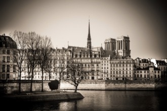 The exterior of Notre Dame Cathedral is prominently displayed along the Seine River in Paris,