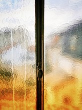 How sunlight interacts with a textured glass window, creating a mosaic of colors and reflections