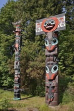 Totem poles, Chief Skedans Mortuary Totem Pole and Ga'akstalas Totem Pole, Stanley Park, Vancouver,