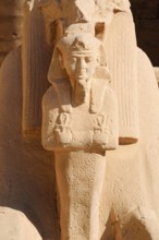 Statue of the Pharaoh in the pose of Osiris, Karnak Temple, Luxor, Egypt