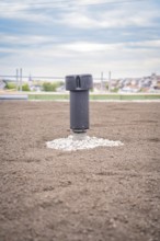 Single ventilation shaft on a green roof with city in the background, green roof, house