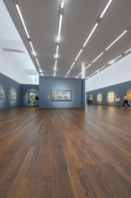 Large room with wooden floor and modern art on the walls under bright lighting, Frieder Burda