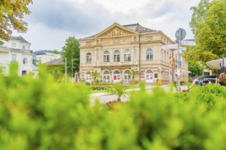 View of a magnificent building, surrounded by a well-tended garden and lots of greenery, Baden