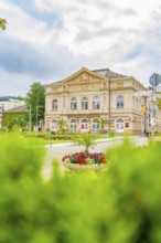 View of a historic building, surrounded by a beautiful garden and flowering plants, Baden Baden,
