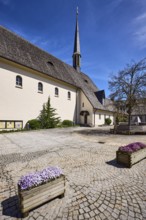 Parish church Bayerisch Gmain, church, square, paving stones, flower pots, garden pansies (Viola