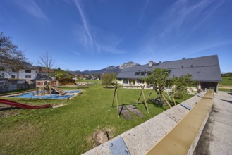 Catholic kindergarten St.Bruder Klaus, building, playground equipment, swing, sandpit, meadows,