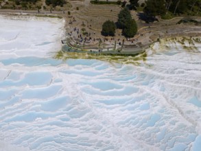 Panoramic view of famous limestone sinter terraces with turquoise water in Turkey, aerial view,