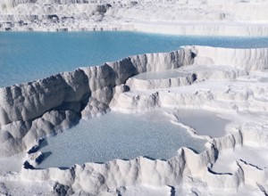 Natural limestone formations with turquoise-coloured water in several cascades. Structure appears