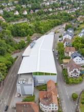 Modern buildings surrounded by trees and houses in a green, urban environment, City Centre Calw,