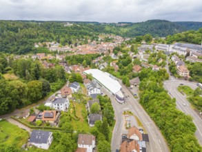 Wide aerial view of an urban landscape with green nature and modern buildings, City Centre Calw,