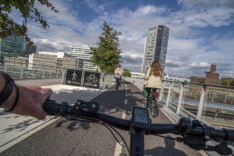 Cycling over the Moreelsebrug, pedestrian and cyclist bridge over the tracks of Utrecht Centraal,
