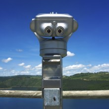 Visitors use the coin-operated binoculars in Auvergne, France, to enjoy breathtaking views of the