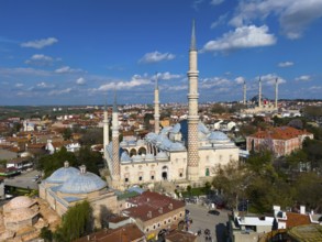 Impressive mosque with slender minarets surrounded by a city, aerial view, Mosque, Üç-Serefeli