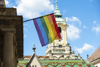 Rainbow flag on the Primatial Palace, in the background is the Old Town Hall of Bratislava,