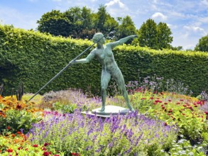 Sculpture Statue of bronze javelin thrower from 1937 by sculptor and artist Ernst Seger in flower