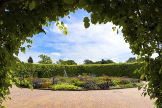 View of flower roundabout Lindenrund with bronze javelin thrower statue from 1937 by Ernst Seger in