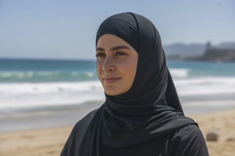 Close up of woman in black hijab at sunny beach. Generative ai, AI generated