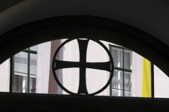 Black paw cross in the skylight of the entrance to the Deutschordenshaus in Vienna, Austria, for