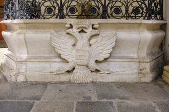 Heraldic double-headed eagle on the fountain (Schweizerhofbrunnen) in the inner courtyard of the