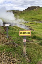 Sign with inscription closed, warning, do not enter, steaming valley, Reykjadalur bathing area,