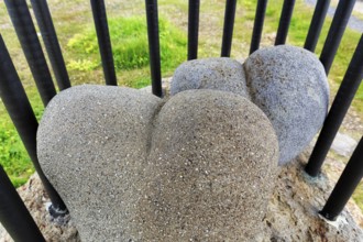 Two hearts, moulded from lava rock, bars, cage, symbolic image, memorial to Fjalla-Eyvindur,