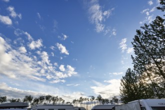 Cumulus, roofs of caravans and motorhomes on a campsite in the evening, Suðurland, Sudurland,