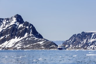 Expedition ship in the Arctic Ocean, mountains, sea, Fugelfjorden, Spitsbergen, Svalbard