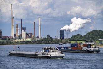 Industrial backdrop of the ThyssenKrupp Steel steelworks in Duisburg-Bruckhausen, cargo ships on