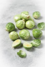 Fresh Brussels sprouts, raw, top view, on a gray table, no people
