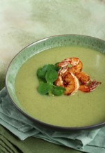 Pea cream soup, with shrimp, green soup, homemade, top view, no people