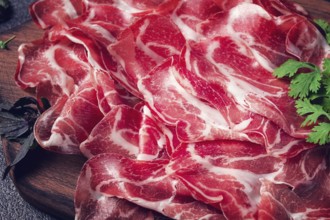 Sliced cured ham, prosciutto, italian dish, delicacy, parma ham, top view, no people