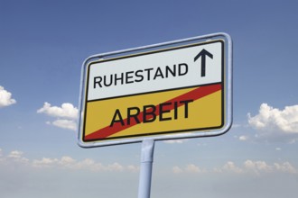 (Photomontage) Town exit sign with the inscription RUHESTAND / ARBEIT detached in front of a blue