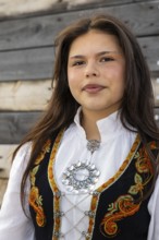 Young woman in traditional traditional costume at the reception for King Harald at the end of coal