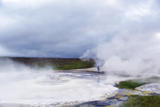 Walkers on a wooden path, sulphur vapour, Hveravellir geothermal area, Icelandic highlands,