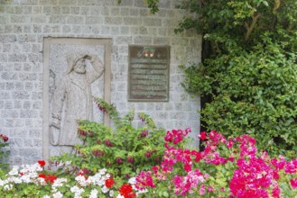 Monument, stone relief showing Jacob Andresen Siemens, founder of the seaside resort of Heligoland,