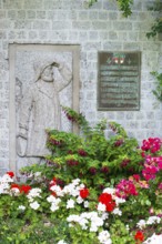 Monument, stone relief showing Jacob Andresen Siemens, founder of the seaside resort of Heligoland,