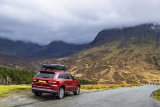 Off road 4x4 car with roof tent on Fairy Pools and Waterfalls, Glen Brittle, Black Cuillin, Isle of