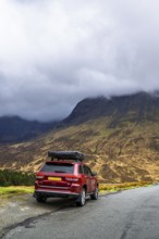 Off road 4x4 car with roof tent on Fairy Pools and Waterfalls, Glen Brittle, Black Cuillin, Isle of