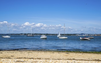 Boats over Brownsea Island, Poole, Dorset, England, United Kingdom