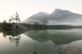 Magical sunrise with fog at Hintersee near Ramsau in Berchtesgadener Land