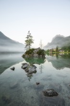 Magical summer sunrise with fog at Hintersee near Ramsau in Berchtesgadener Land
