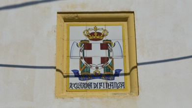 Guardia di Finanza, Coat of arms with crown and shield on beige background, textual elements,