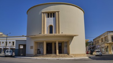 Theatre, Cinema, Round modern building with columns, surrounded by urban environment, Armando