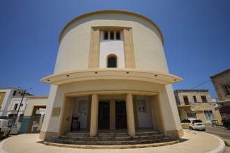 Theatre, Cinema, Round modern building with columns and a blue sky in the background, Armando