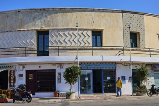 Historic commercial building with decorative elements and display windows, Armando Bernabiti,