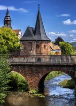 The old town centre with the town wall and the Seemenbach stream, Büdingen, Hesse, Germany