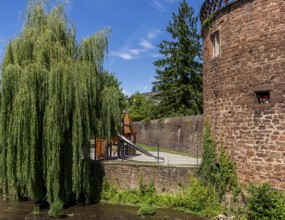 The old town centre with the town wall and the Seemenbach stream, Büdingen, Hesse, Germany