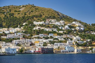Colourful houses on the hillside overlooking the clear blue sea, Lakki, Leros, Dodecanese, Greek