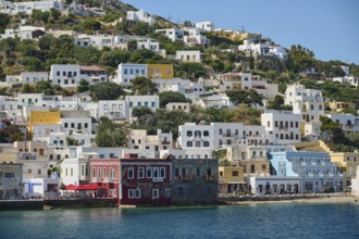 Colourful coastal houses on the hillside, Mediterranean architecture by the sea, Lakki, Leros,