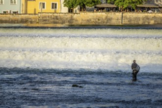 River fisherman at the barrage on the Lech, Landsberg, Upper Bavaria, Bavaria